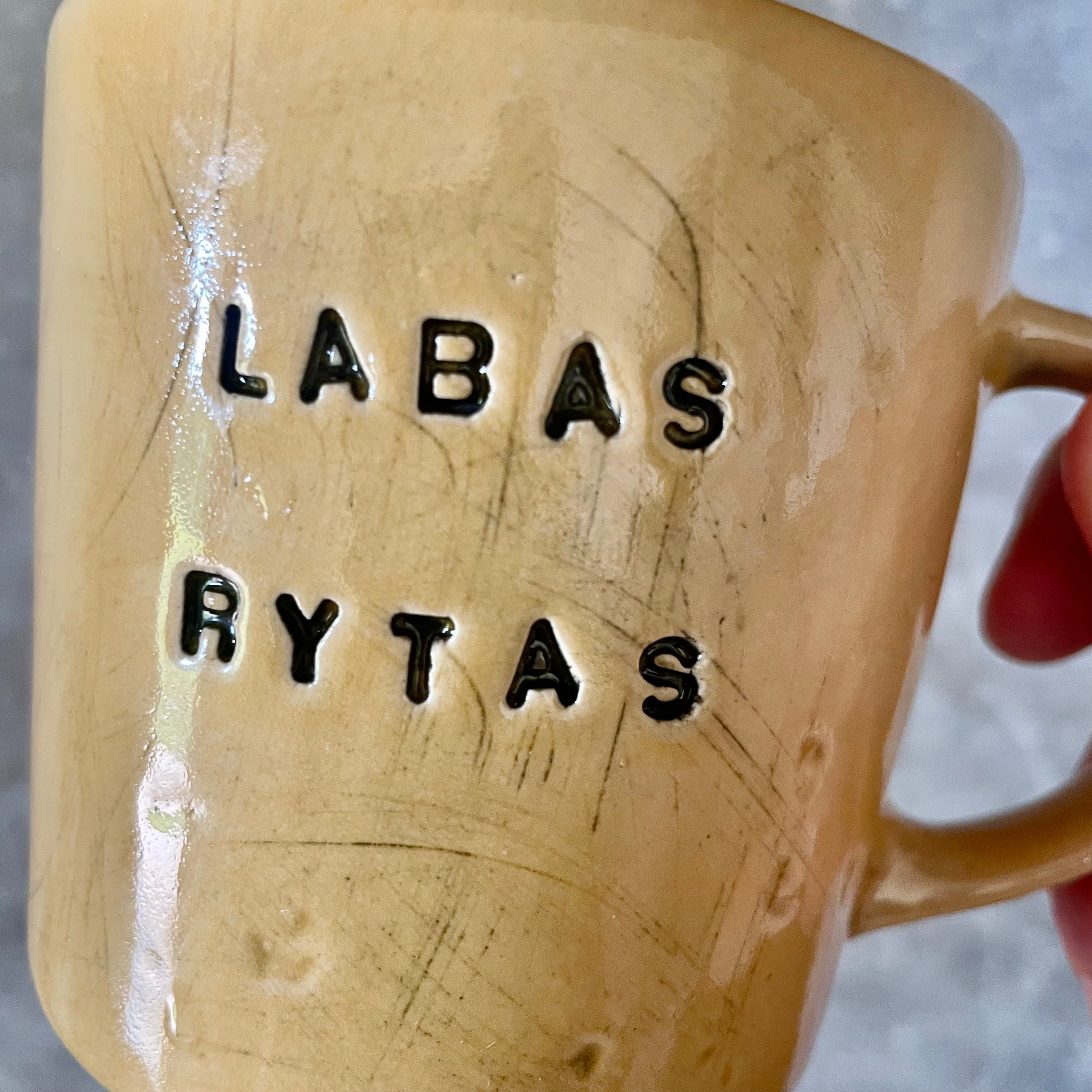 Yellow cup with saying