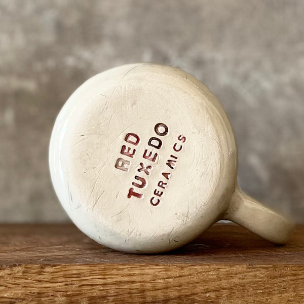 Ceramic coffee mug with writer quote