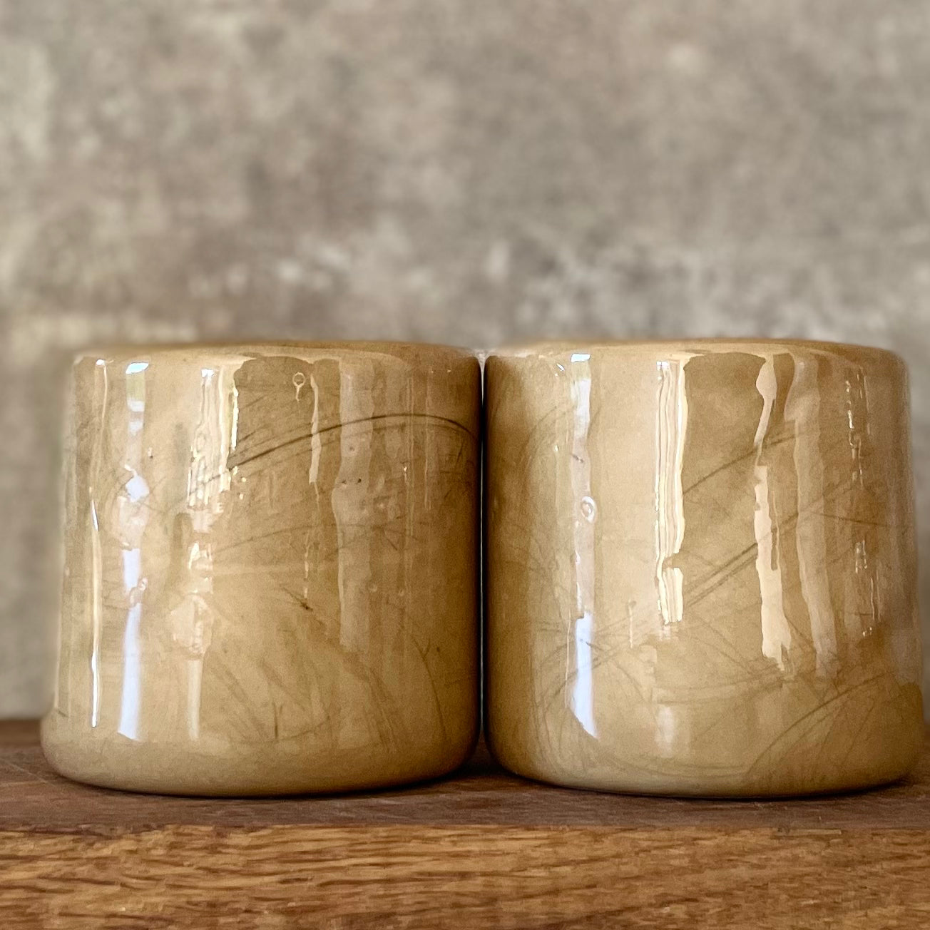 A pair of coffee mugs RELAX