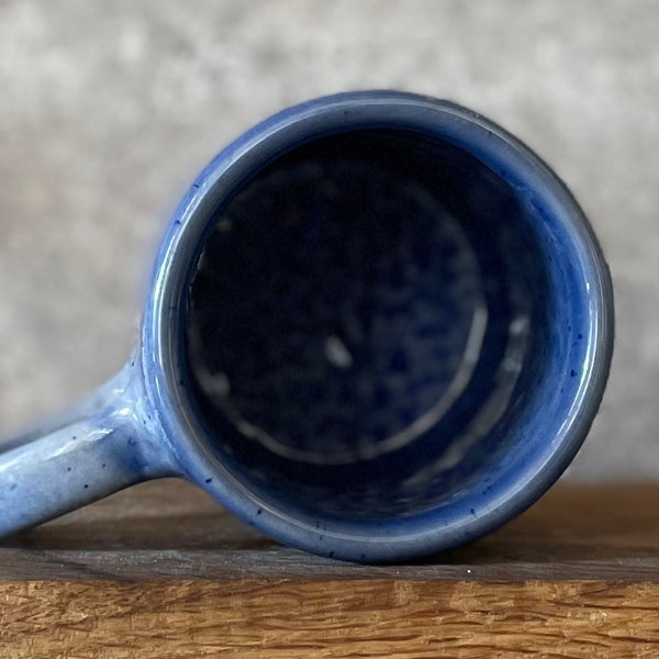 Blue ceramic coffee mug with quote