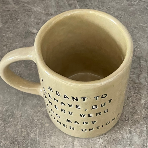 Yellowish coffee mug with funny saying