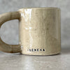Ceramic mug with quote in Lithuanian