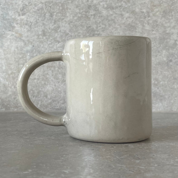 Ceramic mug with saying about coffee