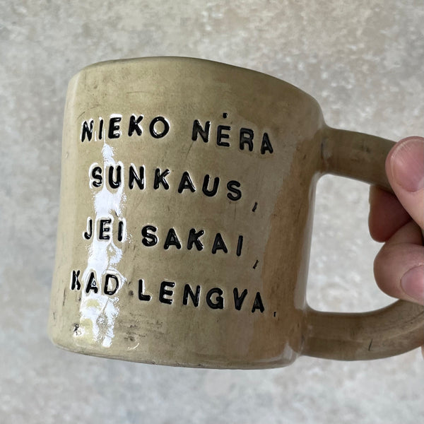 Ceramic mug with quote in Lithuanian