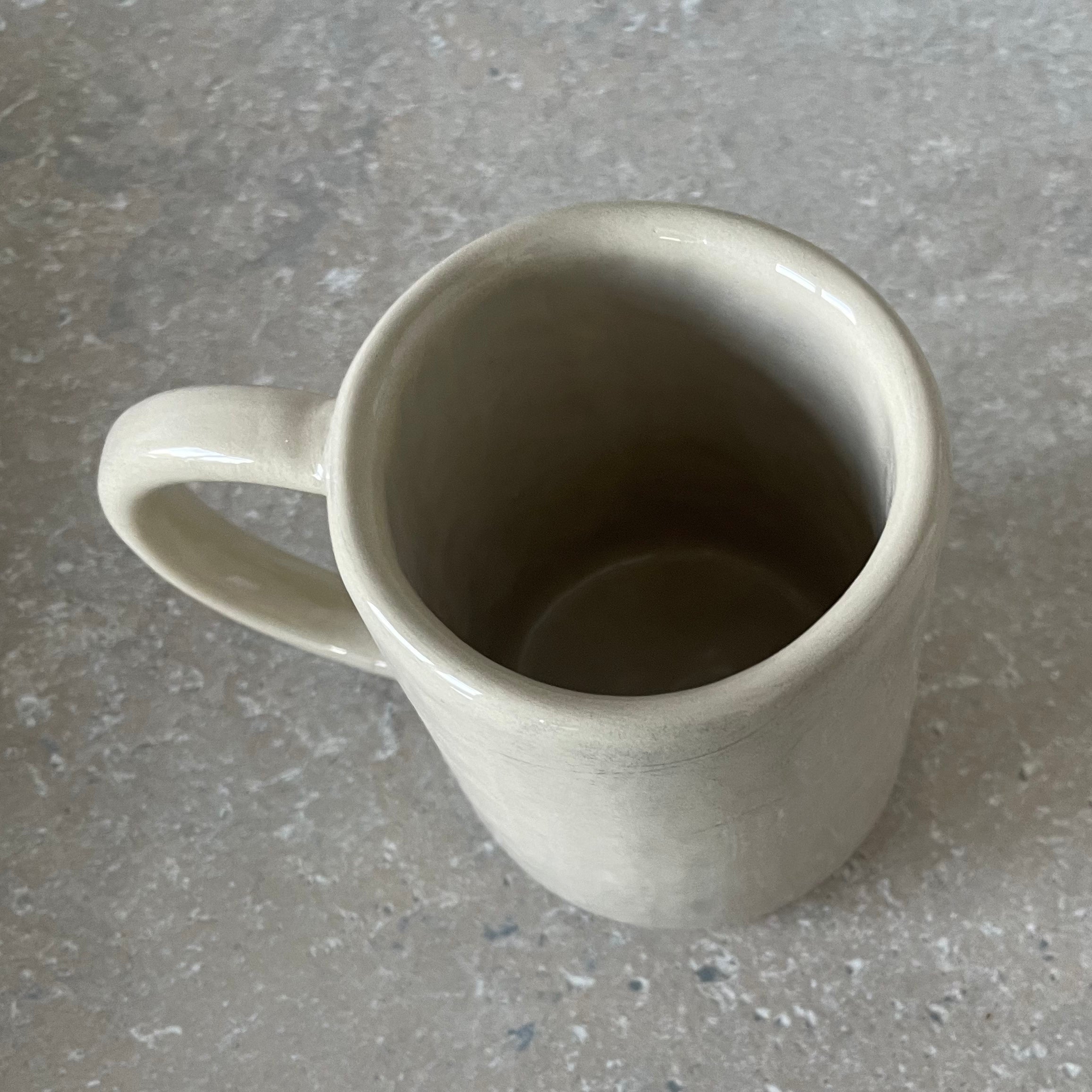 Ceramic mug with saying about coffee