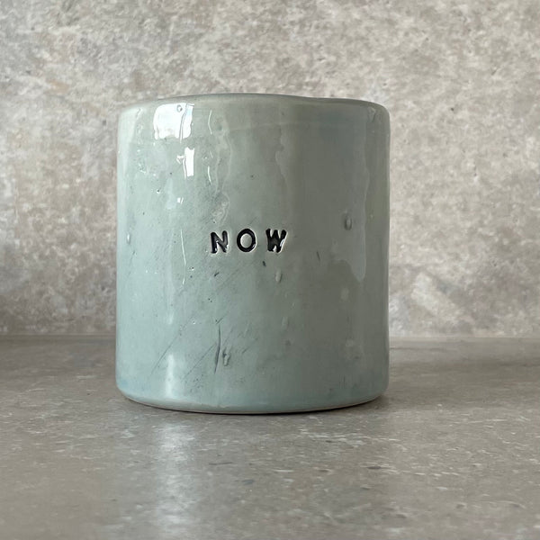 Handmade ceramic mug with word Now | Red Tuxedo Ceramics