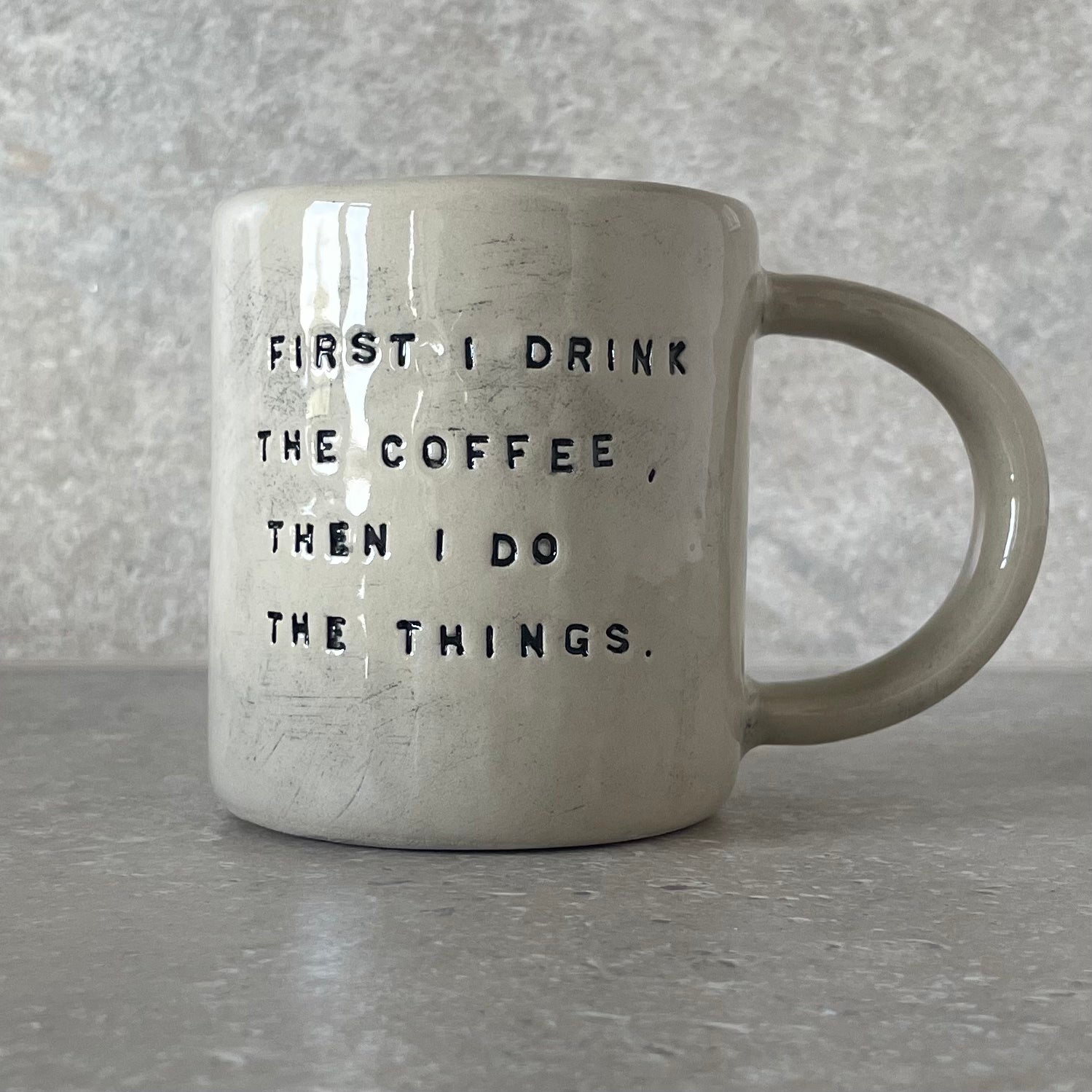 Ceramic mug with saying about coffee