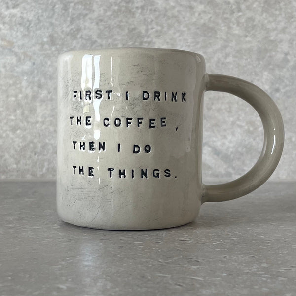 Ceramic mug with saying about coffee