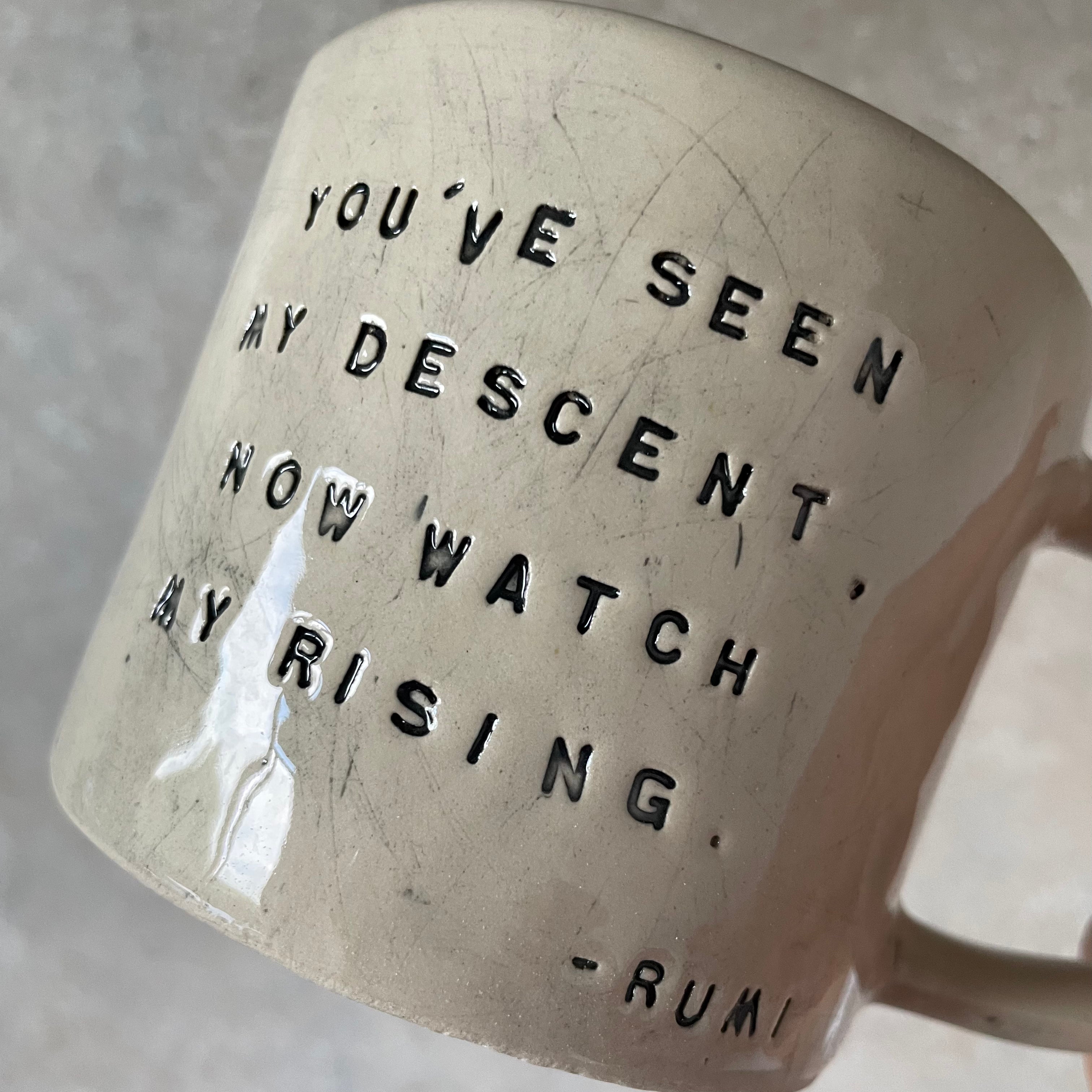 White ceramic mug with quote by Rumi