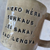 Ceramic mug with quote in Lithuanian
