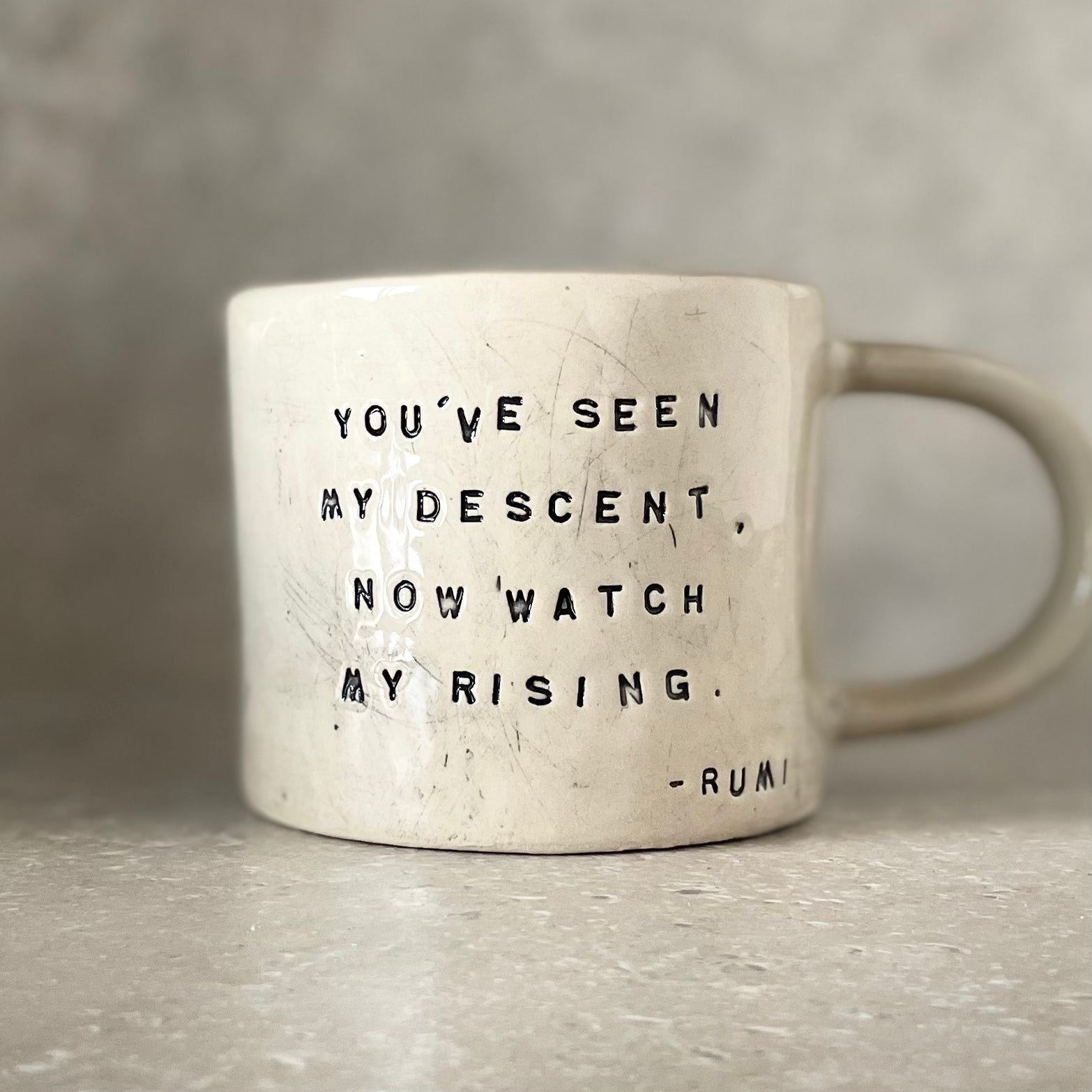 White ceramic mug with quote by Rumi