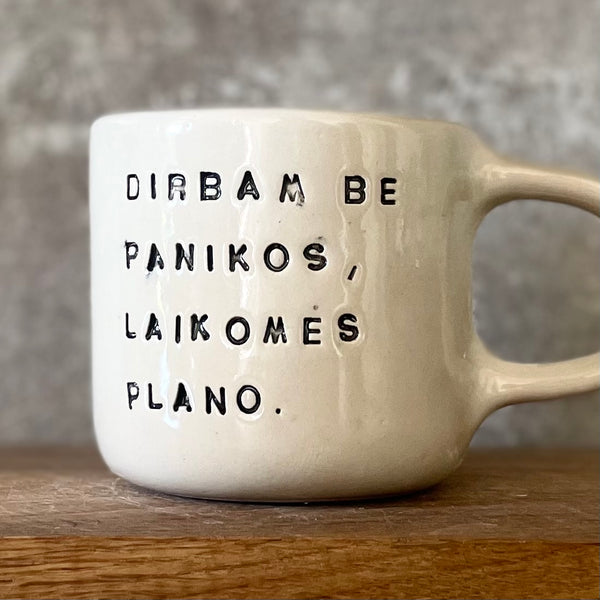 White ceramic mug with words about work