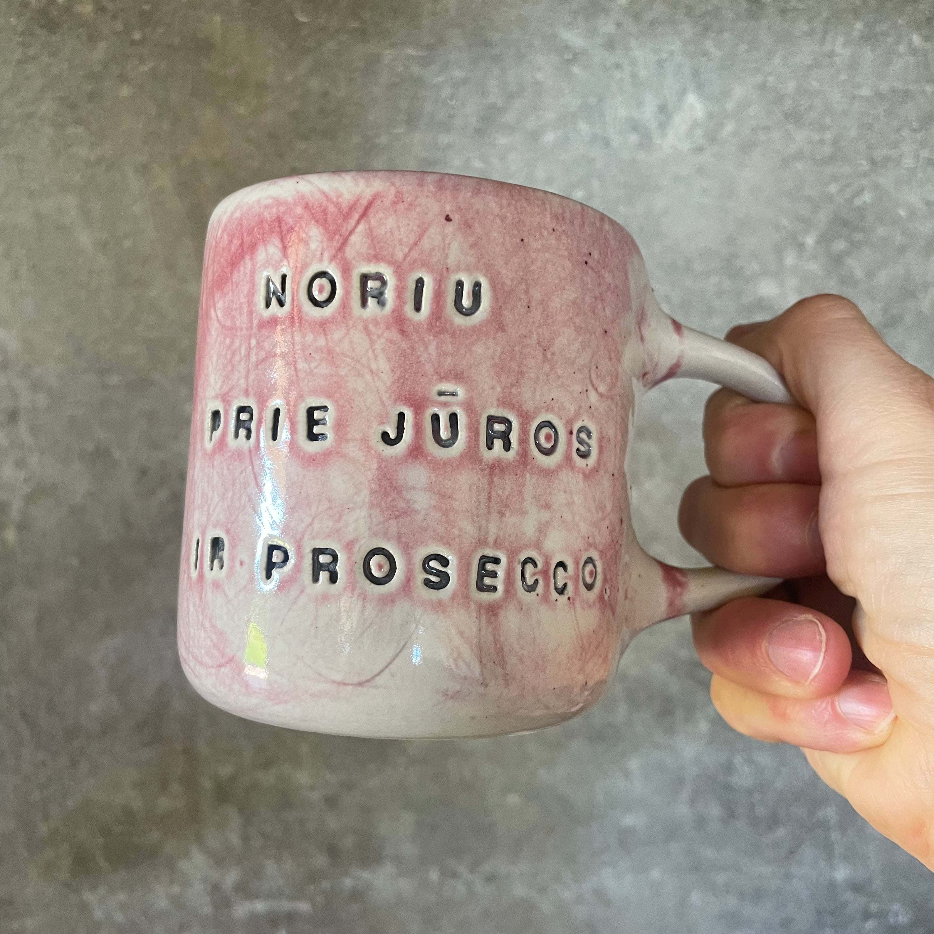 Light-berry-pink mug with words in Lithuanian