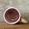 Light-berry-pink mug with words in Lithuanian