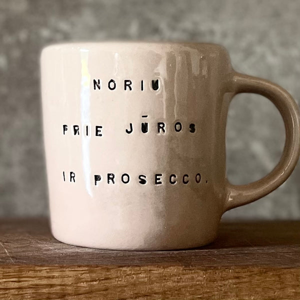 Pale pink mug with prosecco saying