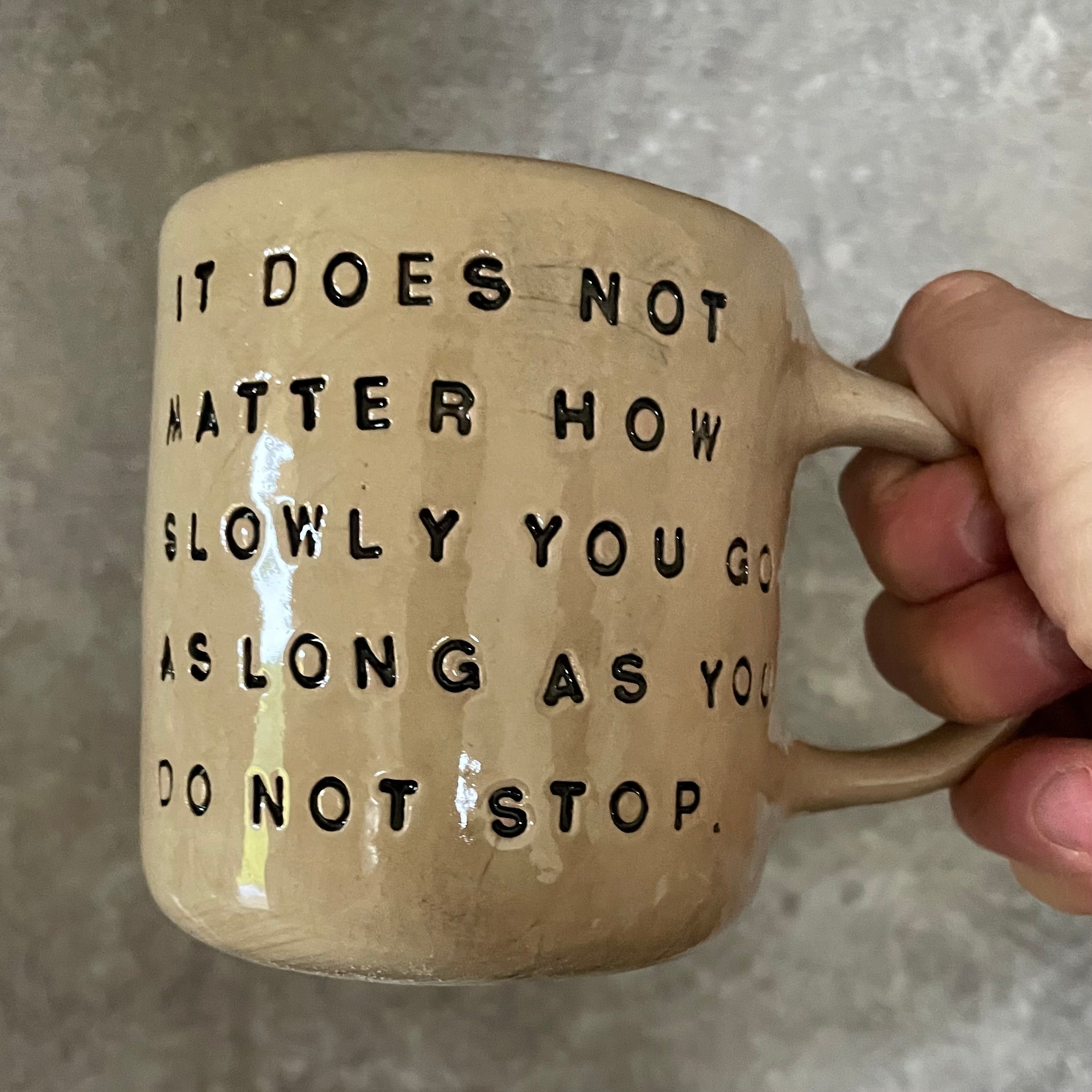 Beige mug with quote by Confucius