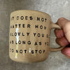 Beige mug with quote by Confucius