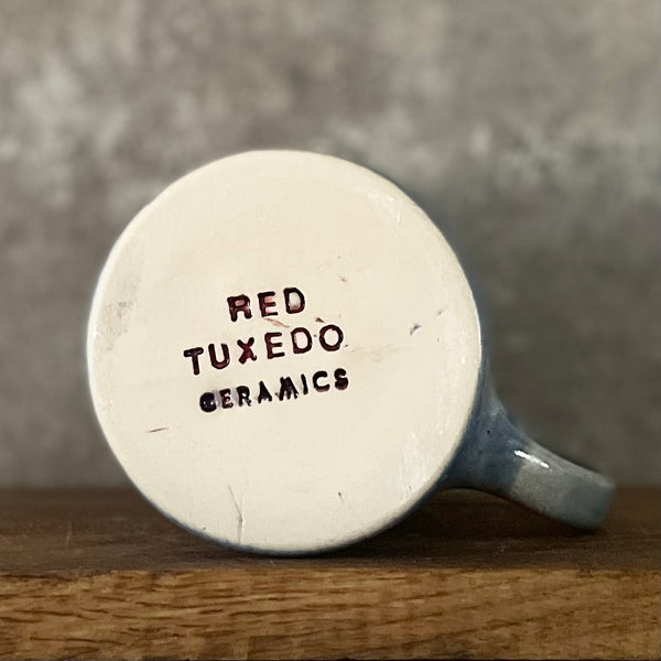 Handmade blue ceramic mug with funny text