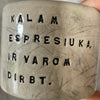 A set of small mugs with words in Lithuanian