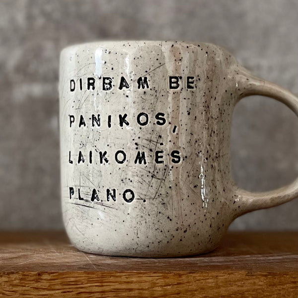 Speckled mug with words about work - another