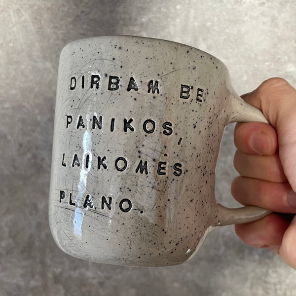 Speckled mug with words about work - another