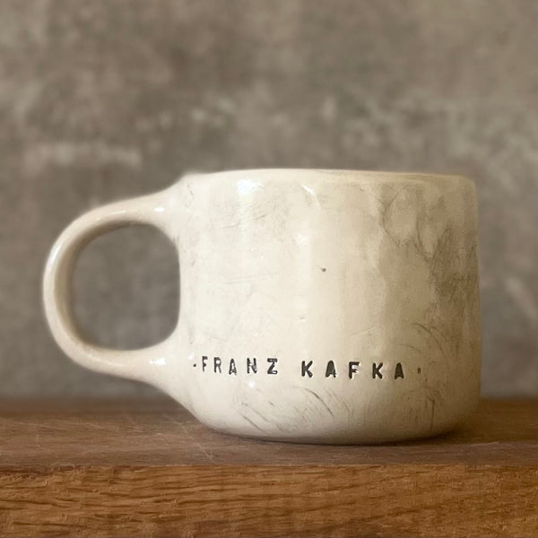 Ceramic coffee mug with quote by Kafka