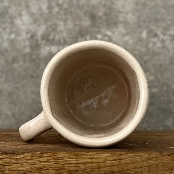 Pale pink mug with prosecco saying