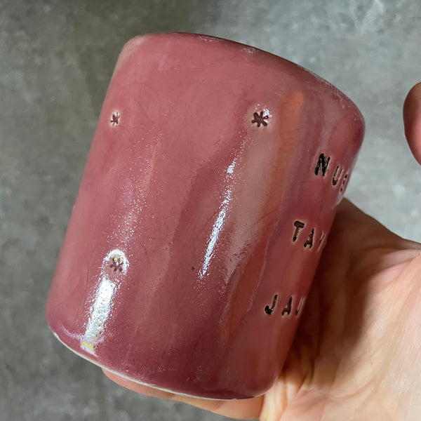 Pink mug with calming words without handle