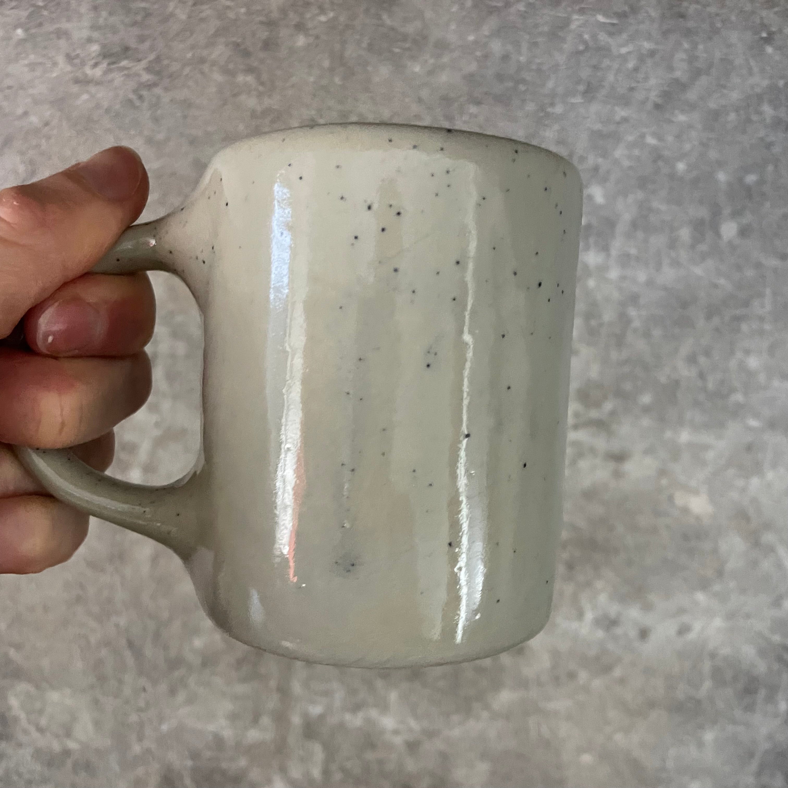 Speckled mug about champagne and the sea