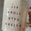 Speckled gray mug about music
