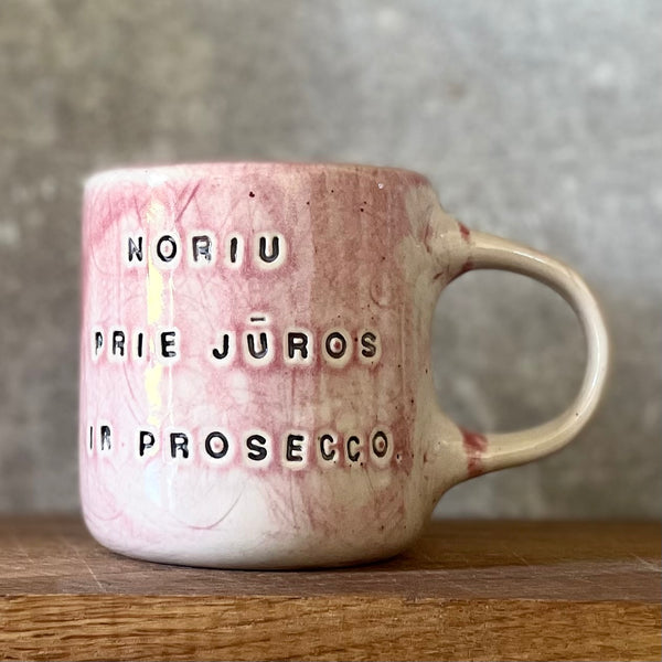 Light-berry-pink mug with words in Lithuanian