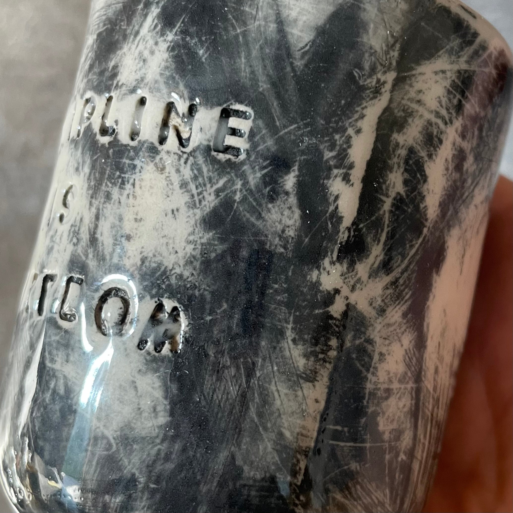 Small dark mug about discipline