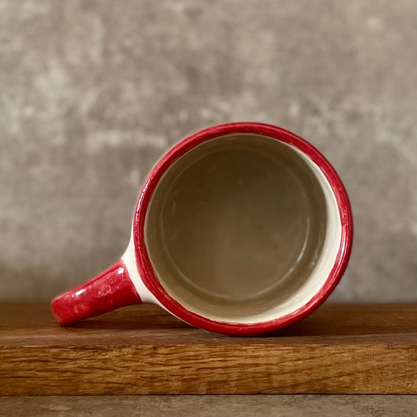 Puodelis su raudona rankena SKANIOS KAVELĖS