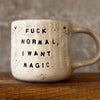 Ceramic mug with saying about magic