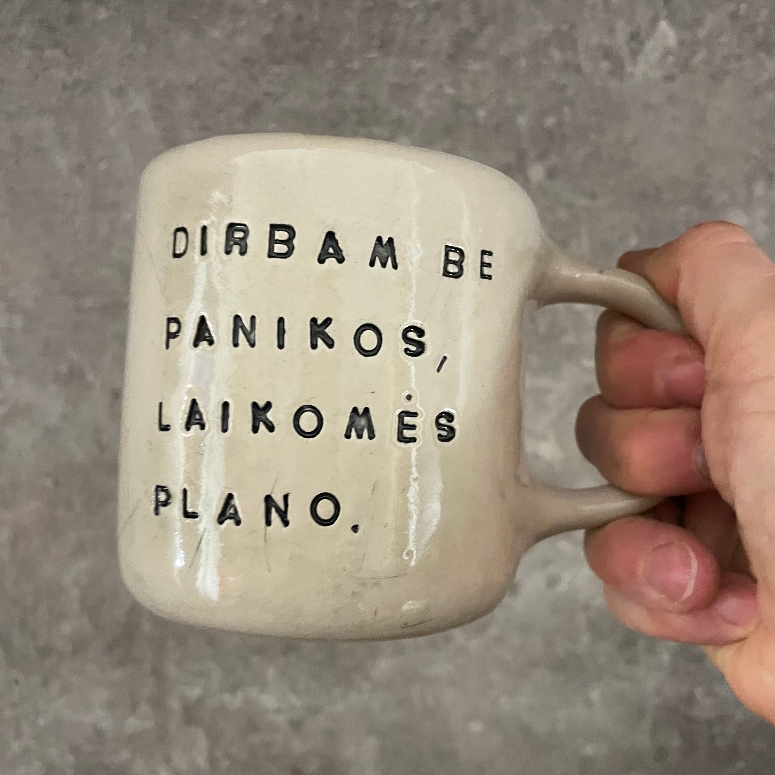 White medium ceramic mug with words about work
