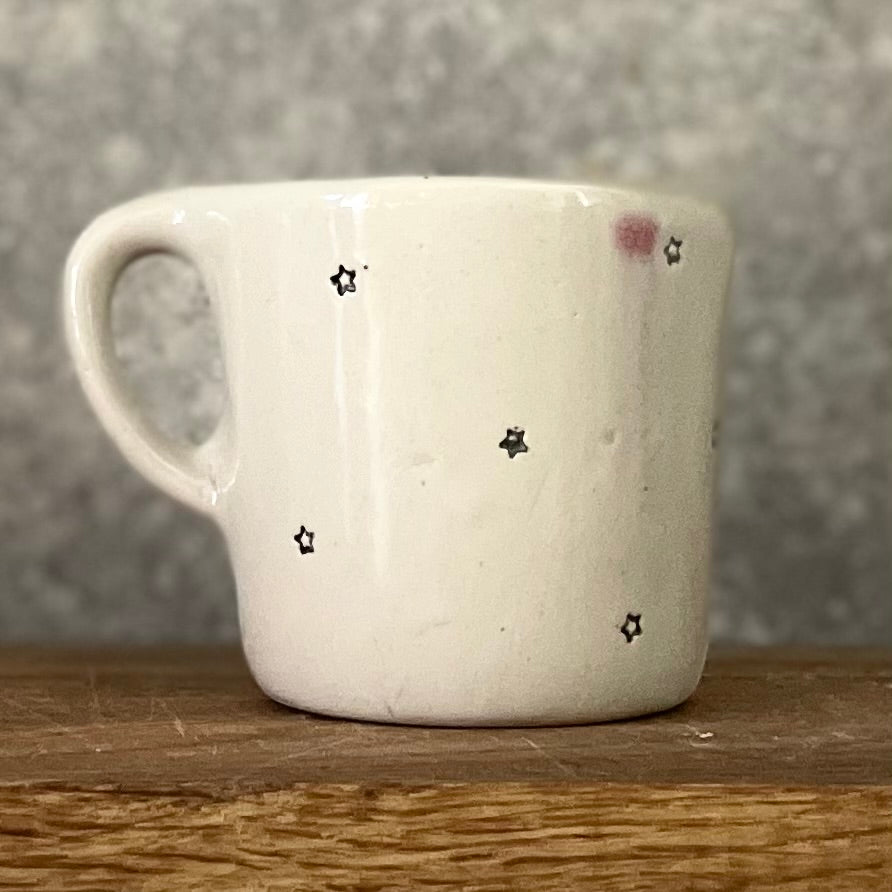 Small mug with magic words and little stars