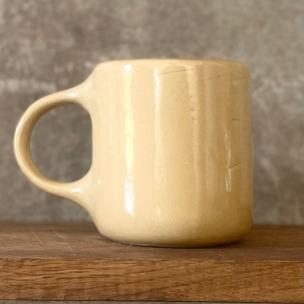 Yellow ceramic mug about luck