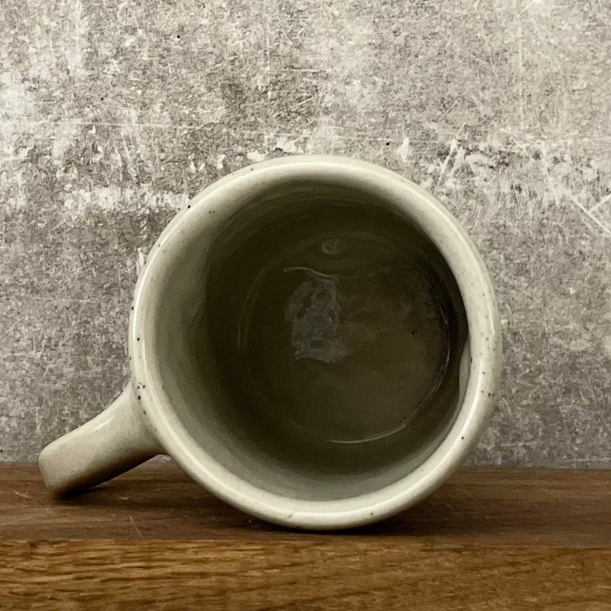 Speckled mug with words about work