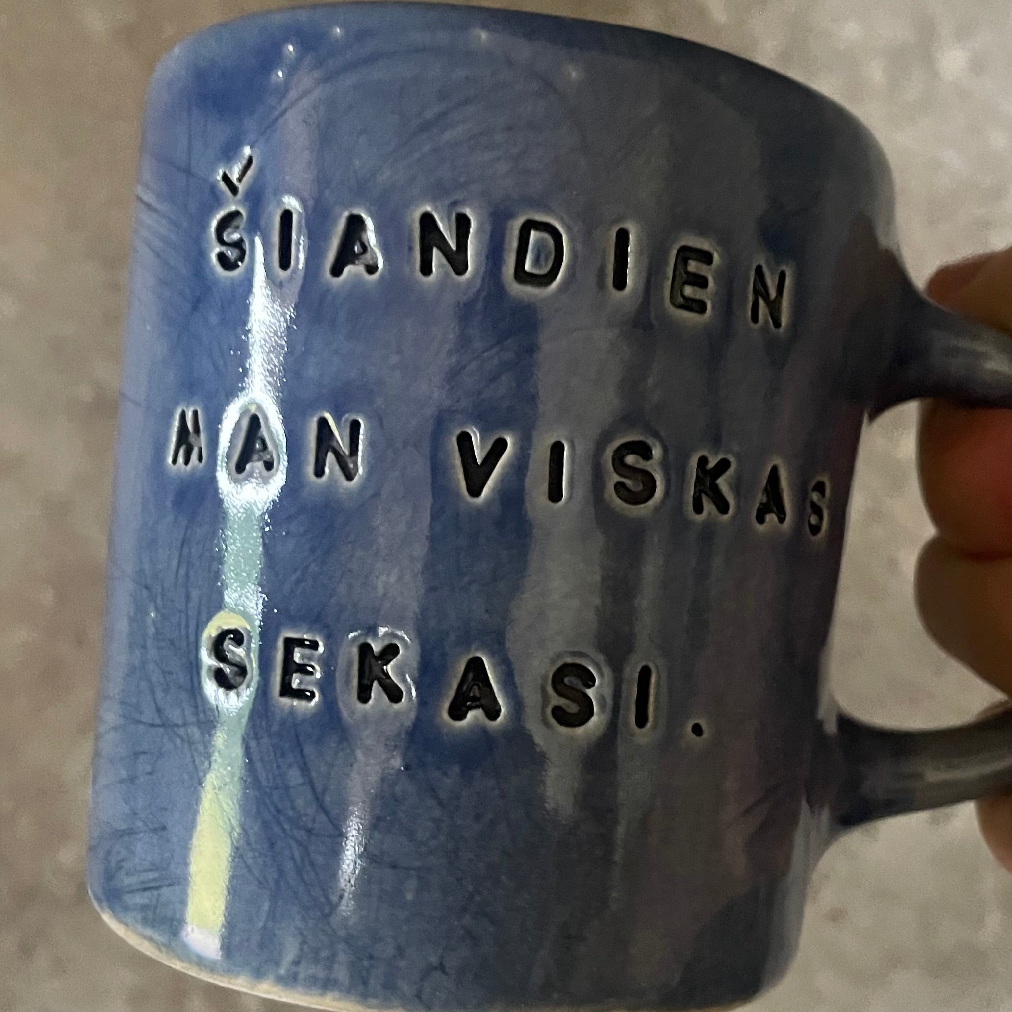 Blue ceramic mug about luck