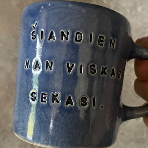 Blue ceramic mug about luck