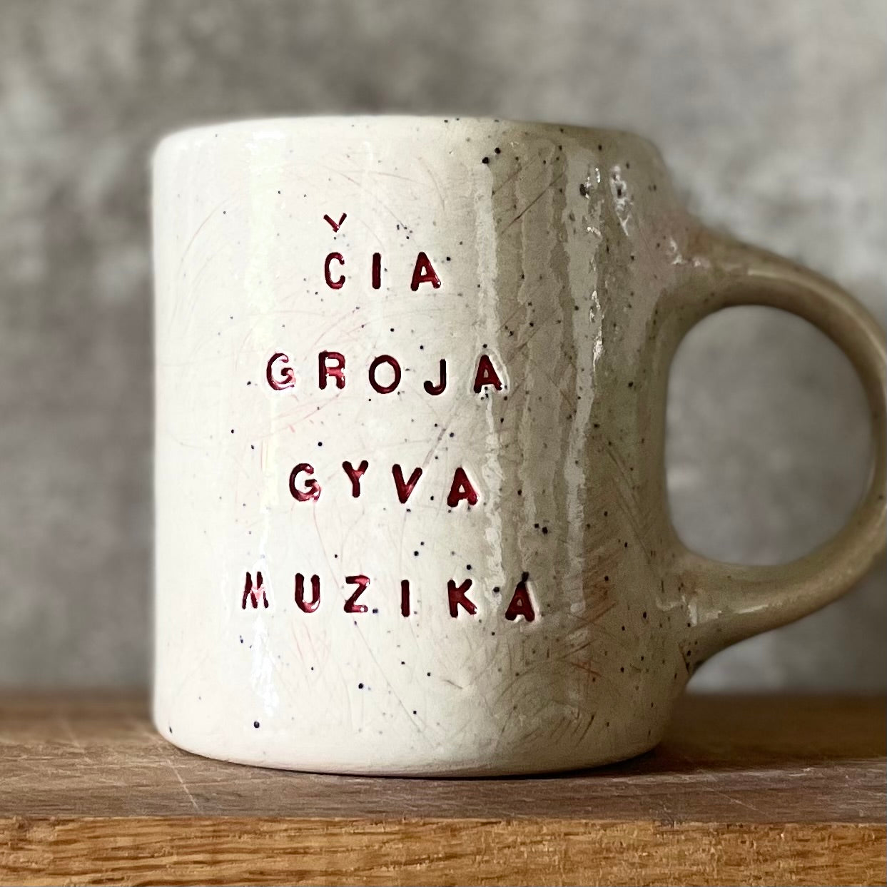 Speckled gray mug about music