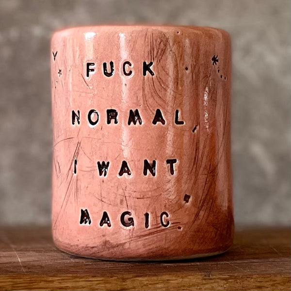 Red tumbler mug with magic saying