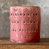 Pink mug with calming words without handle