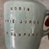 Small blue mug with words in Lithuanian