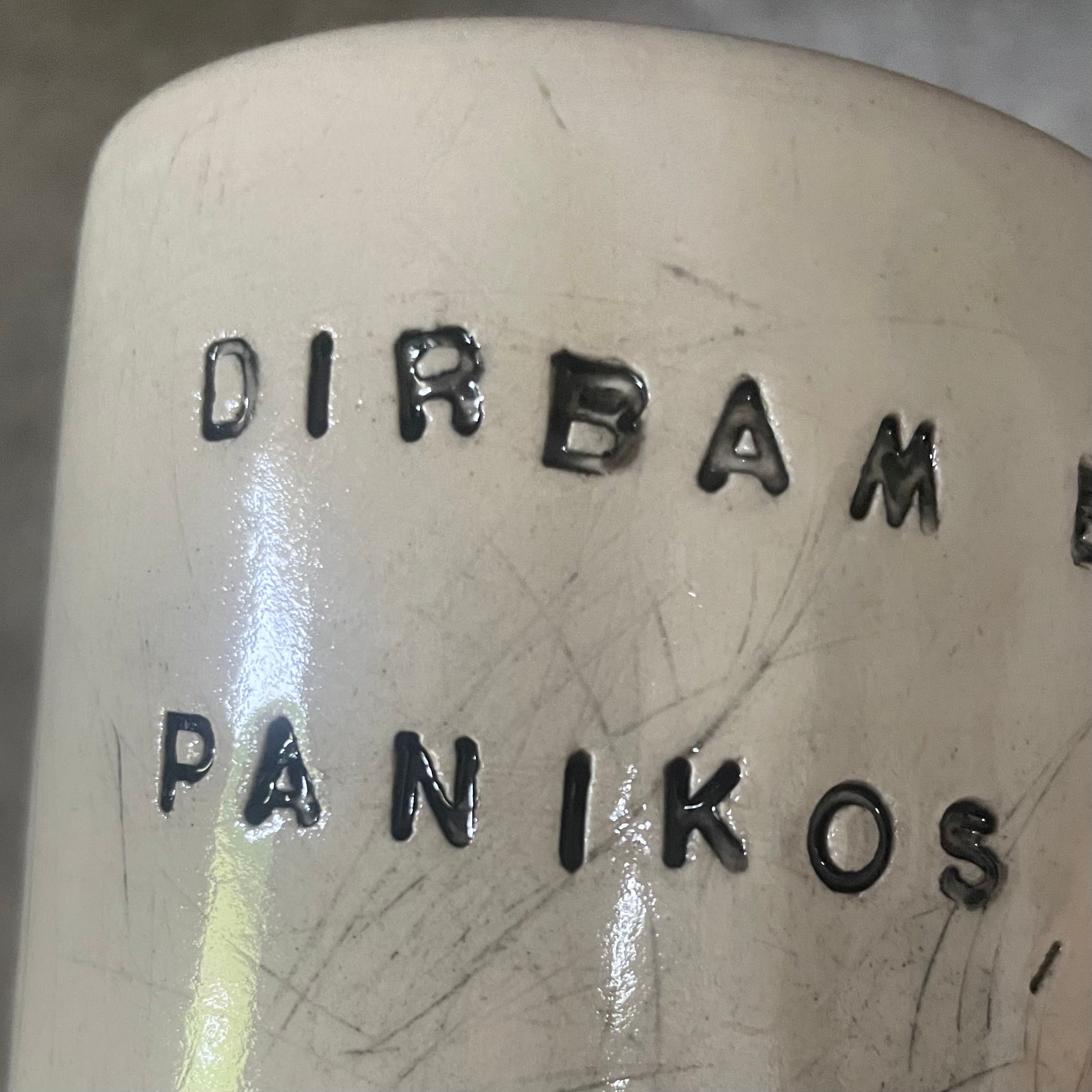 Two big ceramic mugs with words about work