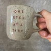 Off-white mug ONE STEP AT A TIME
