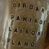 Dark brown tumbler mug with words about work
