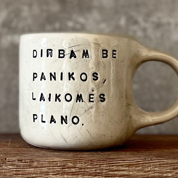 White medium ceramic mug with words about work