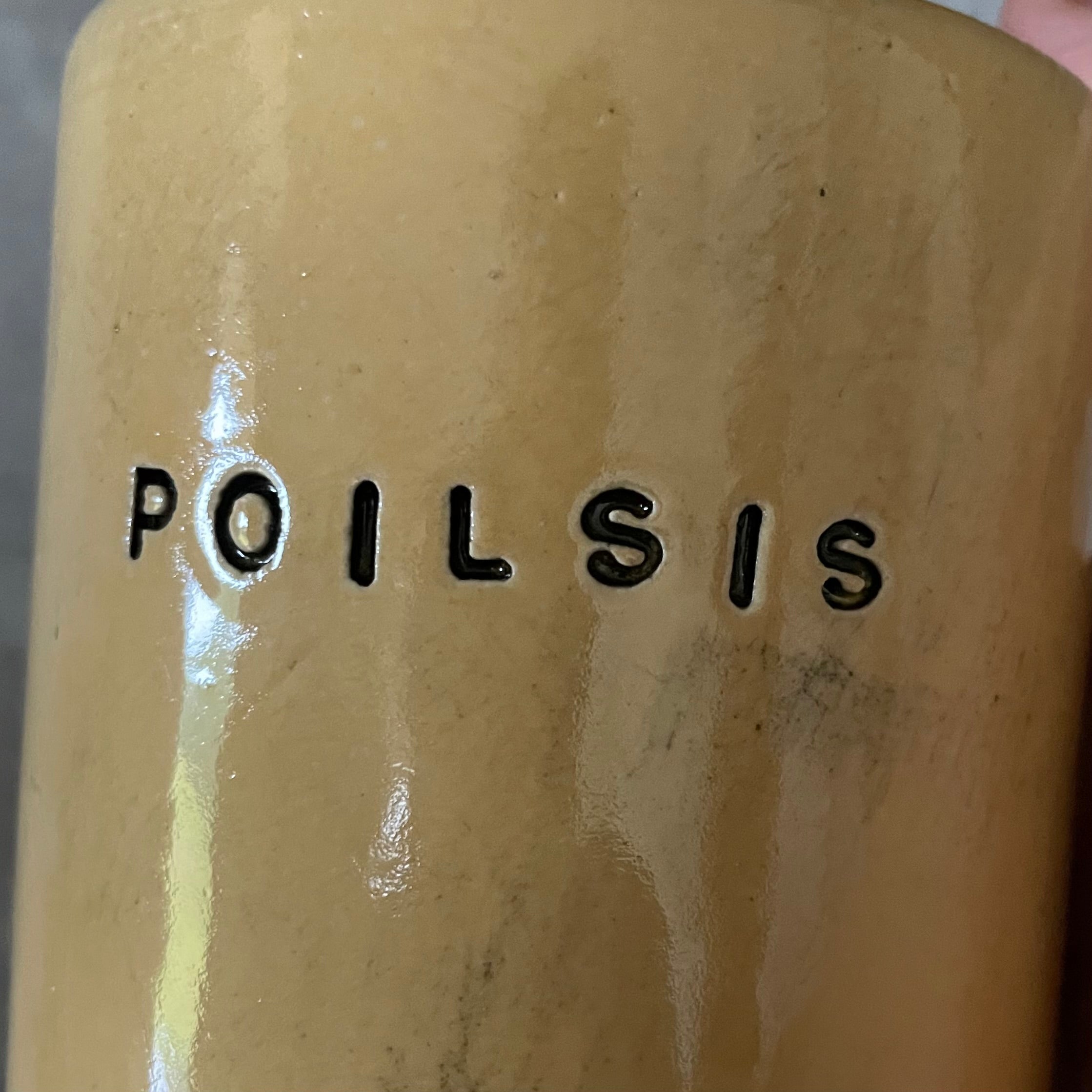Yellow tumbler mug with word in Lithuanian POILSIS