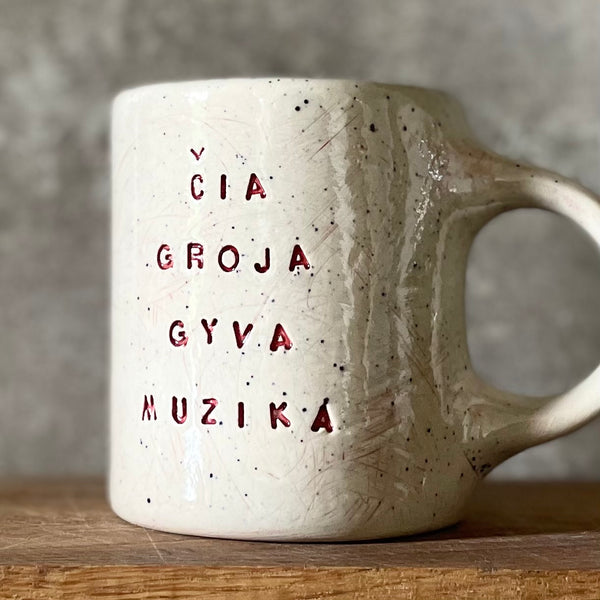 Speckled gray mug about music